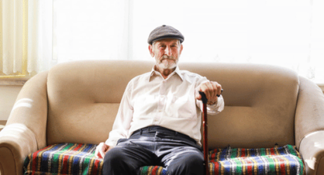 senior sitting on a couch