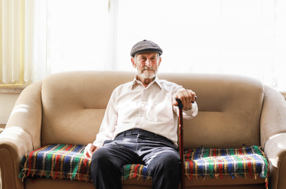 senior sitting on a couch